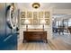 Open foyer with wood floors, decorative lamps, and view into dining area at 39 Indigo Ln, Goose Creek, SC 29445