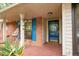 Inviting front porch with brick floor, blue shutters, and decorative bird statue at 39 Indigo Ln, Goose Creek, SC 29445