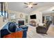Bright living room with a fireplace, built-in shelving, and comfortable seating offers a welcoming space at 39 Indigo Ln, Goose Creek, SC 29445