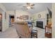 Cozy living room features a brick fireplace, ample seating, and lots of natural light for comfortable living at 39 Indigo Ln, Goose Creek, SC 29445