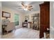 This home office area includes a ceiling fan, a bookshelf, and a desk area at 39 Indigo Ln, Goose Creek, SC 29445