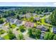 Aerial view of the property and surrounding neighborhood, lined with lush trees and green lawns at 407 Glenmore Dr, Moncks Corner, SC 29461