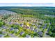 Spacious community view featuring solar panels, fenced yard, trees, landscaping, lake, and a serene suburban setting at 407 Glenmore Dr, Moncks Corner, SC 29461