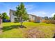 Large, fenced backyard featuring green grass, mature tree, plus a shed for all your storage needs at 407 Glenmore Dr, Moncks Corner, SC 29461