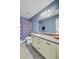 Well-lit bathroom featuring neutral walls, a toilet, vanity with storage and a shower/bath with patterned curtain at 407 Glenmore Dr, Moncks Corner, SC 29461