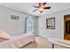 Bright bedroom featuring natural light, fan, and soft carpet providing a cozy and calming space for relaxation at 407 Glenmore Dr, Moncks Corner, SC 29461