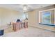 Spacious bonus room filled with natural light, showcasing a large desk and window seating for relaxation at 407 Glenmore Dr, Moncks Corner, SC 29461