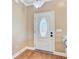 Bright entryway with a white door, hardwood floors, and neutral wall paint at 407 Glenmore Dr, Moncks Corner, SC 29461