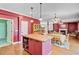 Spacious open-concept kitchen with hardwood floors, island and stainless appliances at 407 Glenmore Dr, Moncks Corner, SC 29461