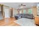Cozy living room with hardwood floors, a comfortable sofa, and plenty of space for relaxation at 407 Glenmore Dr, Moncks Corner, SC 29461