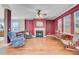 Warm and inviting living area with hardwood floors, a cozy fireplace, and comfortable seating at 407 Glenmore Dr, Moncks Corner, SC 29461