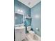 Stylish powder room featuring a white vanity, modern fixtures, and a clean toilet for guest convenience at 407 Glenmore Dr, Moncks Corner, SC 29461