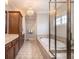 Bright bathroom featuring a standalone tub, glass enclosed shower, double vanity and decorative chandelier lighting at 4073 Blackmoor St, Mount Pleasant, SC 29466
