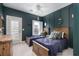 A bedroom featuring 2 twin beds, wall paneling, and a light ceiling fan at 4073 Blackmoor St, Mount Pleasant, SC 29466
