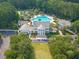 Aerial view of a luxurious clubhouse with a swimming pool, ample parking, and beautiful landscaping at 4073 Blackmoor St, Mount Pleasant, SC 29466