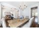 Elegant dining room with chandelier and wood table, seamlessly blending with the adjacent living areas at 4073 Blackmoor St, Mount Pleasant, SC 29466