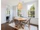 Bright dining area with shutters, natural light, and outdoor access to a covered patio at 4073 Blackmoor St, Mount Pleasant, SC 29466
