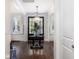 Elegant foyer view featuring dark wood floors, a chandelier, and transom windows above the doorway at 4073 Blackmoor St, Mount Pleasant, SC 29466
