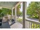 Cozy front porch featuring a seating area and a view of the landscaped front yard and neighborhood at 4073 Blackmoor St, Mount Pleasant, SC 29466