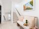Hallway featuring a decorative bench with pillows next to an adjacent stairwell at 4073 Blackmoor St, Mount Pleasant, SC 29466
