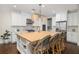 Spacious kitchen with white cabinets, butcher block island, stainless appliances, and modern lighting at 4073 Blackmoor St, Mount Pleasant, SC 29466