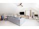 Spacious living room features vaulted ceilings, ceiling fan, and large TV at 4073 Blackmoor St, Mount Pleasant, SC 29466
