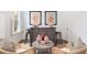 Stylish living room with a dry bar, comfortable seating, and natural light from the window at 4073 Blackmoor St, Mount Pleasant, SC 29466