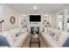 Bright living room featuring a fireplace with built-in shelving, offering a cozy and inviting atmosphere at 4073 Blackmoor St, Mount Pleasant, SC 29466