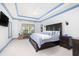 Serene main bedroom with tray ceilings, a king-sized bed, and plenty of natural light, offering a relaxing retreat at 4073 Blackmoor St, Mount Pleasant, SC 29466