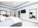 Bright main bedroom featuring tray ceilings, a king-sized bed, and ample closet space, ideal for comfortable living at 4073 Blackmoor St, Mount Pleasant, SC 29466