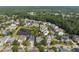 Aerial view of a neighborhood with a pond and mature trees, showcasing a desirable community at 4073 Blackmoor St, Mount Pleasant, SC 29466