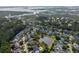 Aerial view of a coastal community, showcasing homes near wetlands and a pond at 4073 Blackmoor St, Mount Pleasant, SC 29466