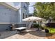 Outdoor patio with grill and brick pavers, offers a relaxing space for entertaining near a lush tropical landscape at 4073 Blackmoor St, Mount Pleasant, SC 29466