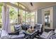 Relaxing screened porch with comfortable seating, ceiling fan, and scenic views at 4073 Blackmoor St, Mount Pleasant, SC 29466