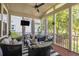 Relaxing screened porch with comfortable seating, ceiling fan, and scenic views at 4073 Blackmoor St, Mount Pleasant, SC 29466
