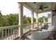 Spacious porch with comfortable seating, ceiling fan and green leafy surroundings at 4073 Blackmoor St, Mount Pleasant, SC 29466