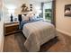 Modern bedroom with stylish decor, bedside tables, and a window with natural light at 421 Radiant Blue Way, Summerville, SC 29486