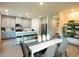 Modern kitchen with stainless steel appliances, a central island and adjacent dining area at 421 Radiant Blue Way, Summerville, SC 29486