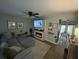 Cozy living room features a modern fireplace, TV, and a comfortable sectional sofa at 5021 Popperdam Creek Dr, North Charleston, SC 29418