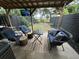 Relaxing outdoor patio area with comfortable seating, perfect for entertaining or enjoying the outdoors at 5021 Popperdam Creek Dr, North Charleston, SC 29418