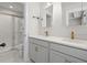 Bathroom with double vanity, gray cabinets, marble floors, and a glass-enclosed shower at 5133 Park Creek Ave, North Charleston, SC 29418