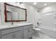 Bathroom with vanity, granite countertops, marble floors, and tub shower combination at 5133 Park Creek Ave, North Charleston, SC 29418
