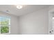 Bedroom features neutral walls, carpet, tray ceilings, and a window providing natural light at 5133 Park Creek Ave, North Charleston, SC 29418