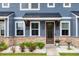 Inviting front porch with stone accents, wood trim, and a decorative flower pot at 5133 Park Creek Ave, North Charleston, SC 29418