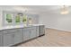 Bright open-concept kitchen and eat-in area featuring quartz counters, stainless appliances, and modern lighting at 5133 Park Creek Ave, North Charleston, SC 29418