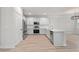 Modern kitchen with stainless steel appliances, white cabinets, and a quartz countertop island at 5133 Park Creek Ave, North Charleston, SC 29418