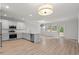 Open-concept living room and kitchen with hardwood floors and ample natural light at 5133 Park Creek Ave, North Charleston, SC 29418
