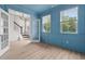 Stylish office with blue walls, white trim, and an open view to the entry at 5133 Park Creek Ave, North Charleston, SC 29418