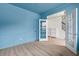 Office showcasing blue walls, modern trim, open view of foyer, and wood flooring at 5133 Park Creek Ave, North Charleston, SC 29418