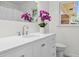 Bathroom with quartz countertop vanity, undermount sink, and large framed mirror at 5172 Sterrett St, North Charleston, SC 29405
